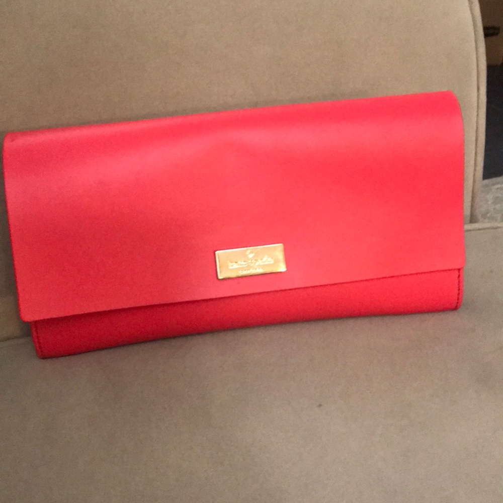 Hot pink kate spade clutch
